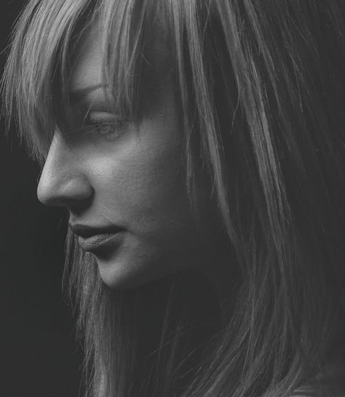 Grayscale Photo of Woman's Face