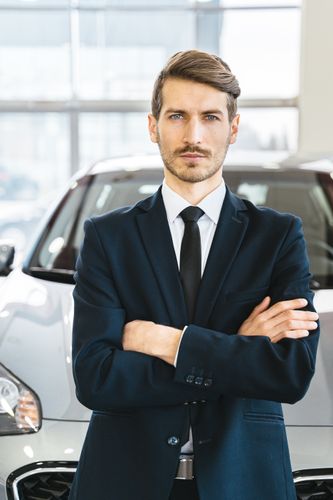 Meticulous automotive specialist inspecting details