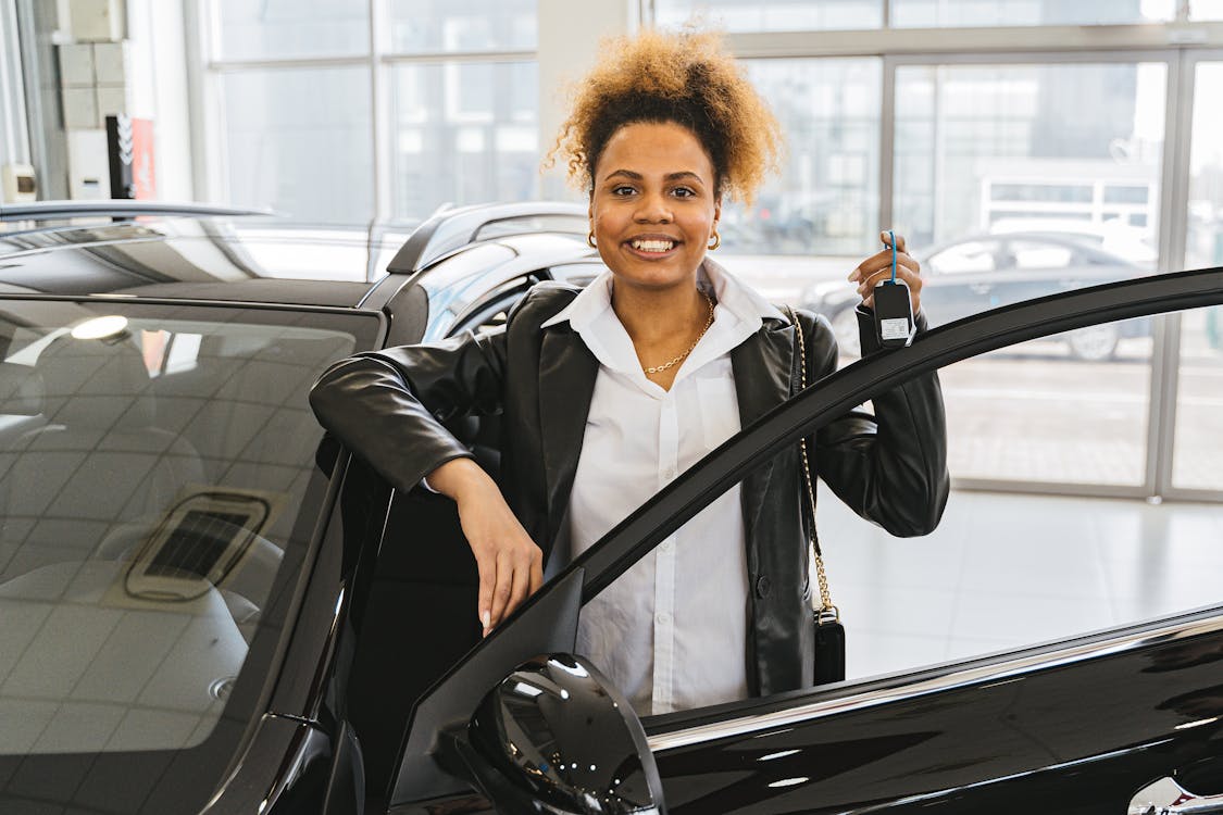 Free Woman in Black Blazer Holding Car Keys Smiling Stock Photo