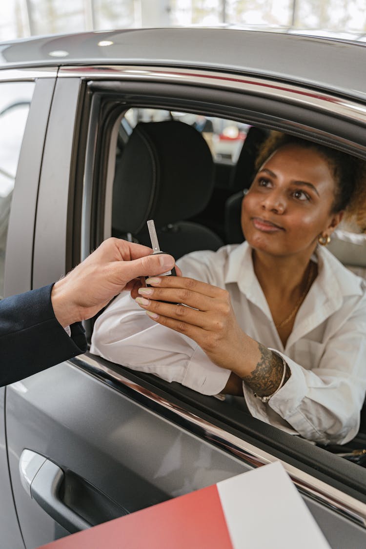 Photo Of A Woman Getting A Car Key