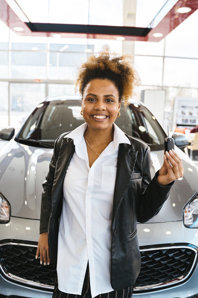 A Woman Holding A Car Key