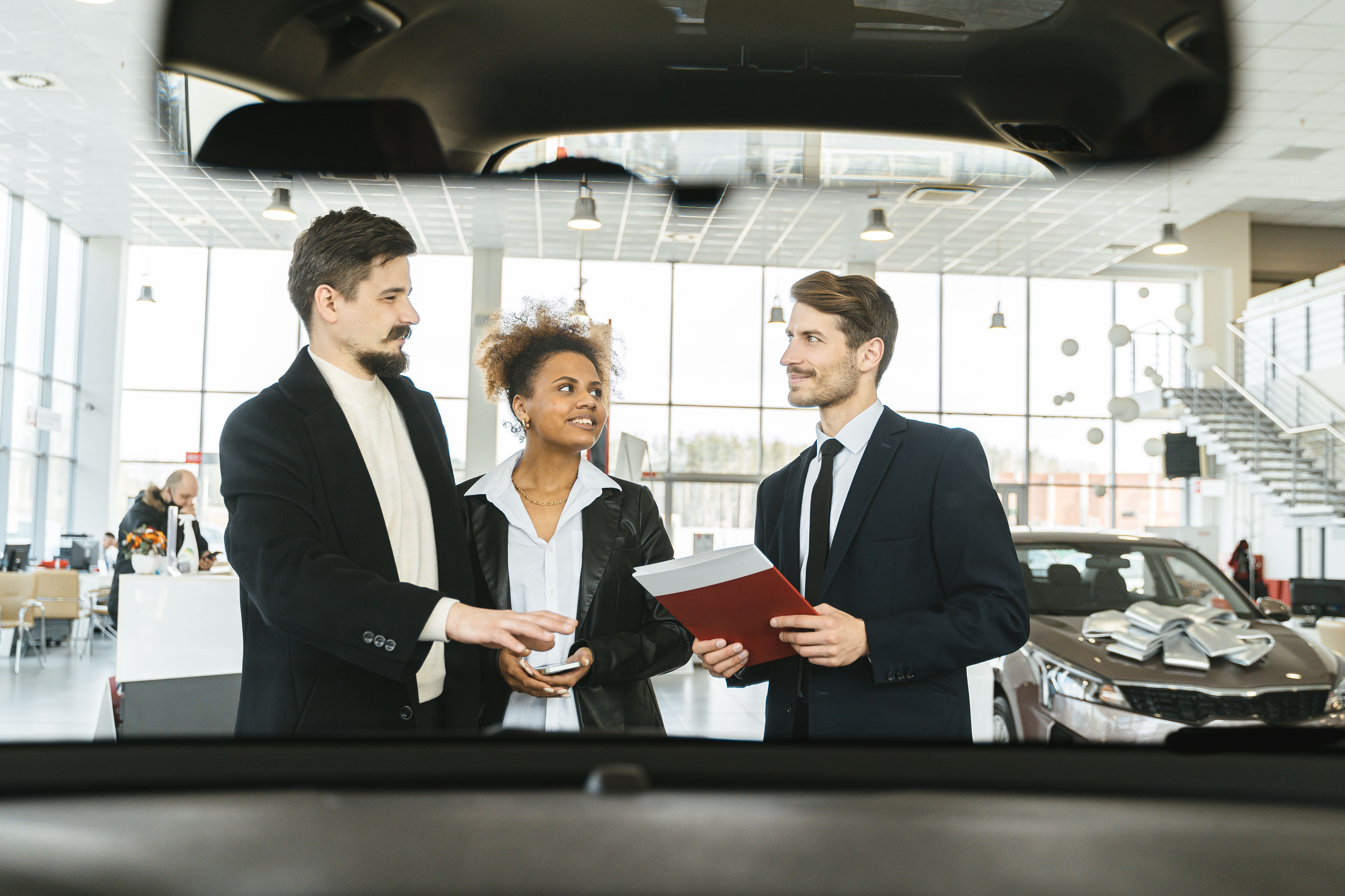 A Salesman Talking to a Coupl