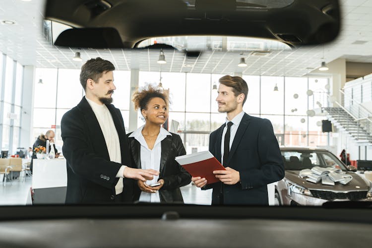 A Salesman Talking To A Couple