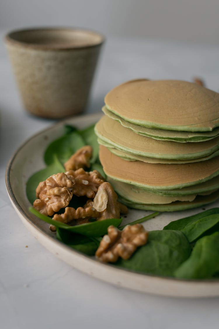 A Plate With Pancakes And Walnuts