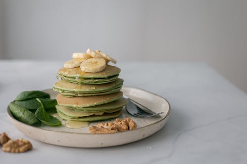 Free Gentle pancakes with syrup and fresh banana on top Stock Photo