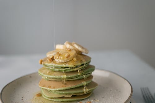 Free Tasty pancakes with sweet fresh banana on top Stock Photo