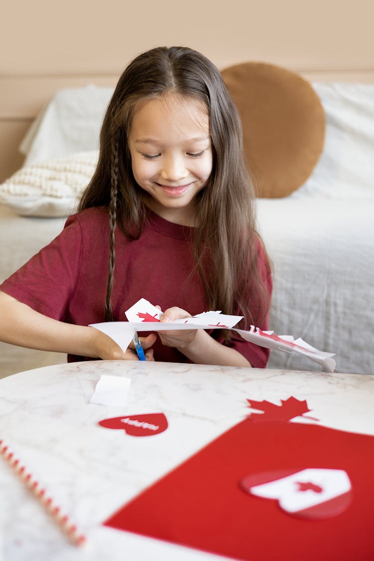 Girl Cutting White Paper