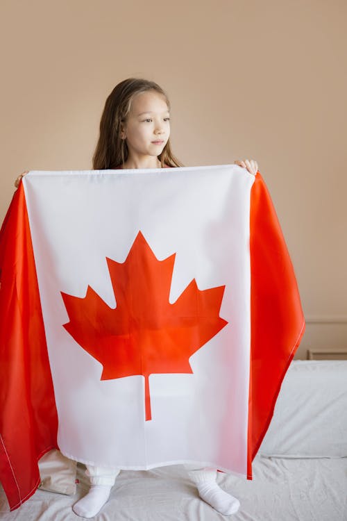 A Girl Holding a Fabric Flag