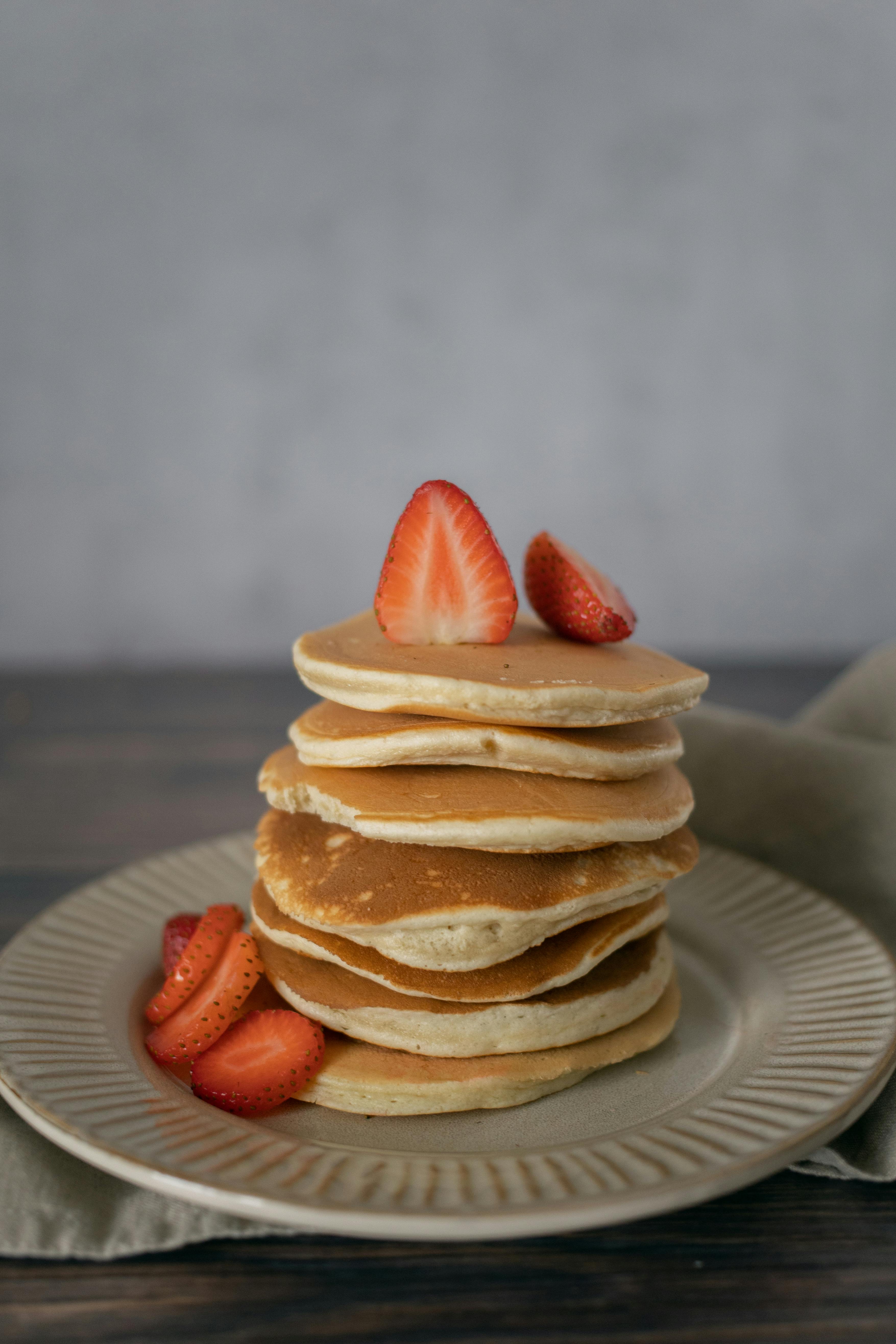 pancakes with strawberries in kitchen