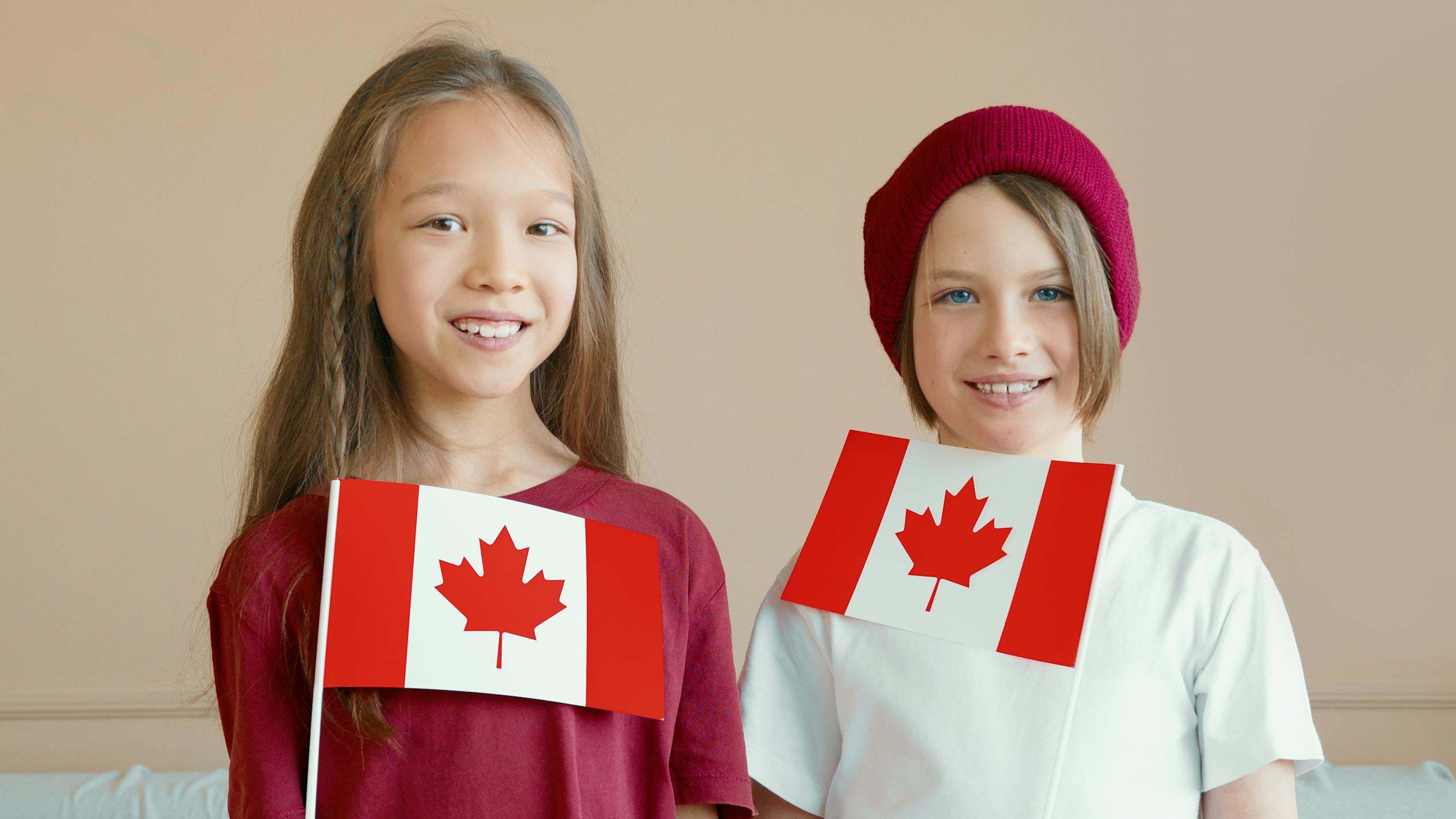 Happy Kids Holding Canadian Flags