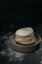 Pancakes with powdered sugar on table