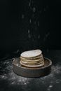 Powdered sugar sprinkling on pancakes