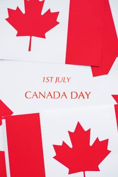 Red and white Canadian flags with 'Canada Day 1st July' text, ideal for holiday themes.