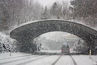 Photo of White Vehicle Crossing a Tunnel