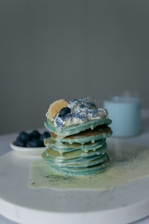 Green Pancake on White Plate