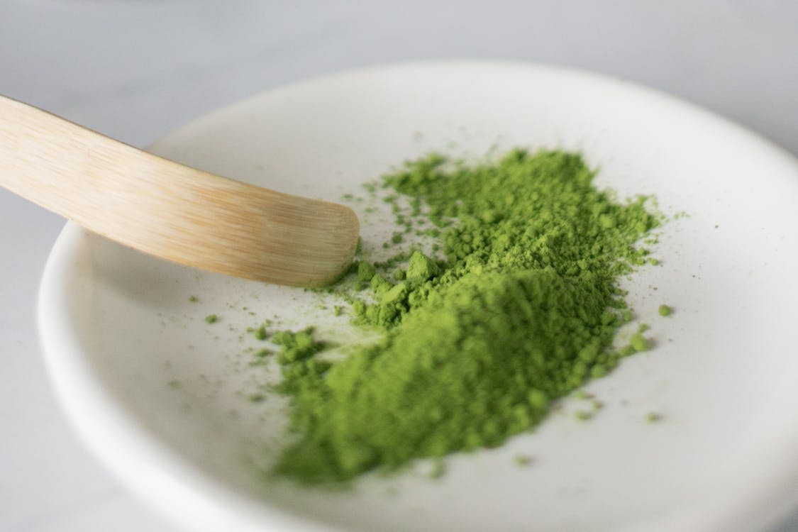 Free Dry green food coloring on plate Stock Photo