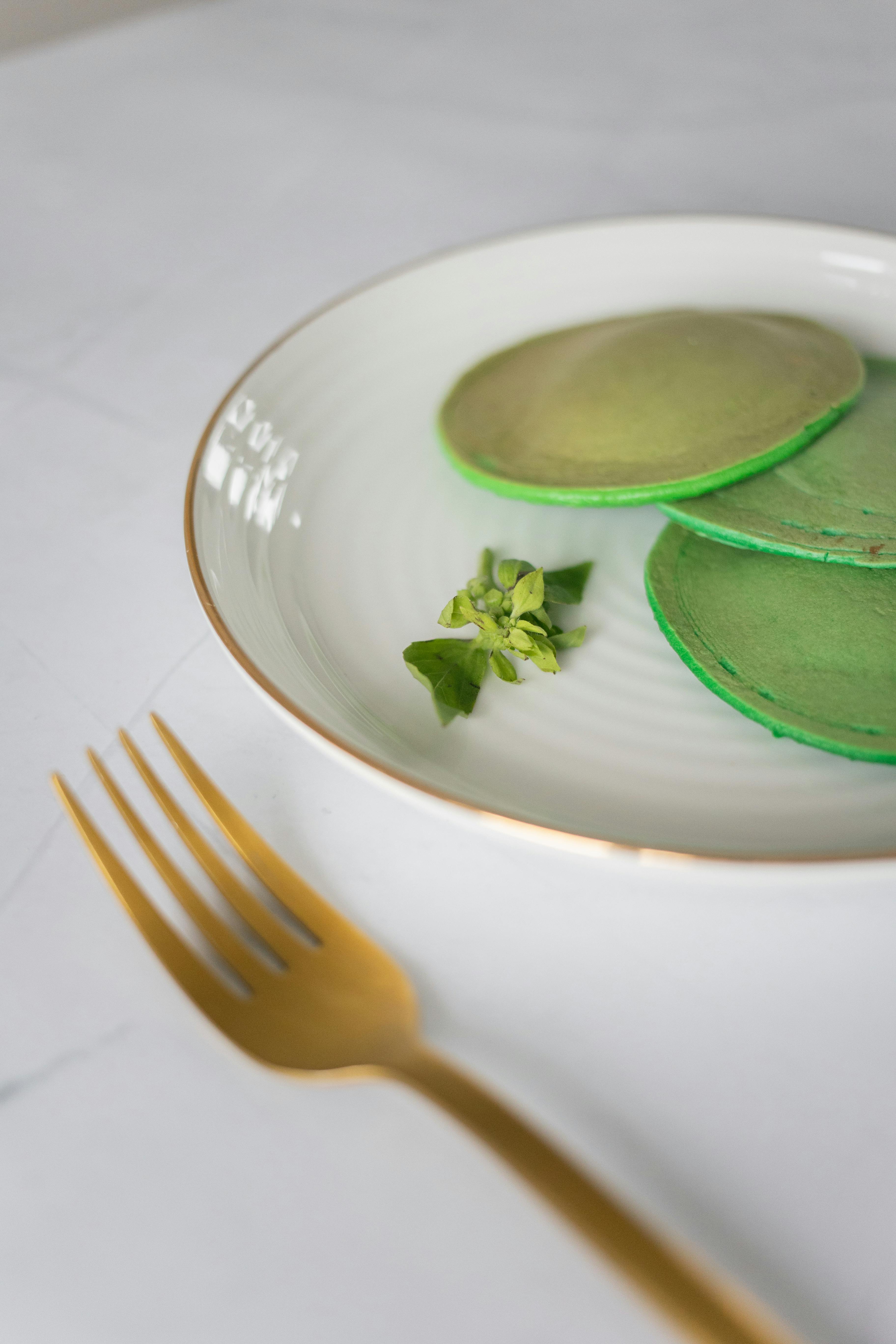 plate with pancakes and fork