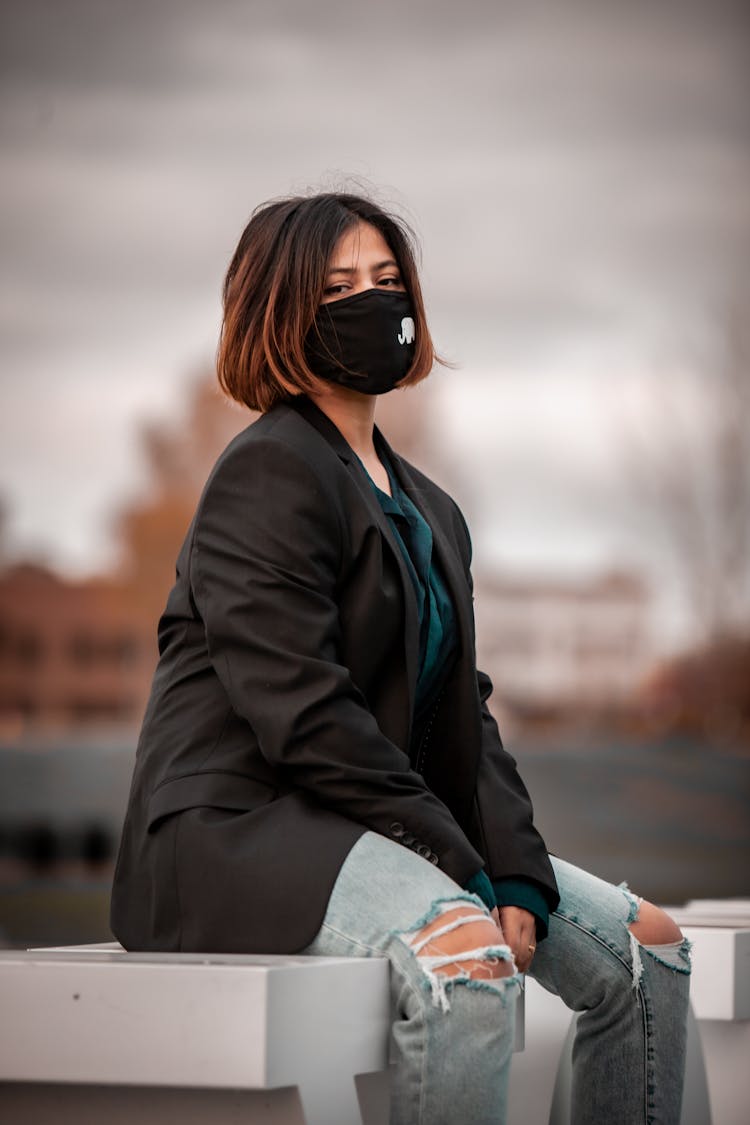 Woman In Black Blazer Wearing A Black Face Mask