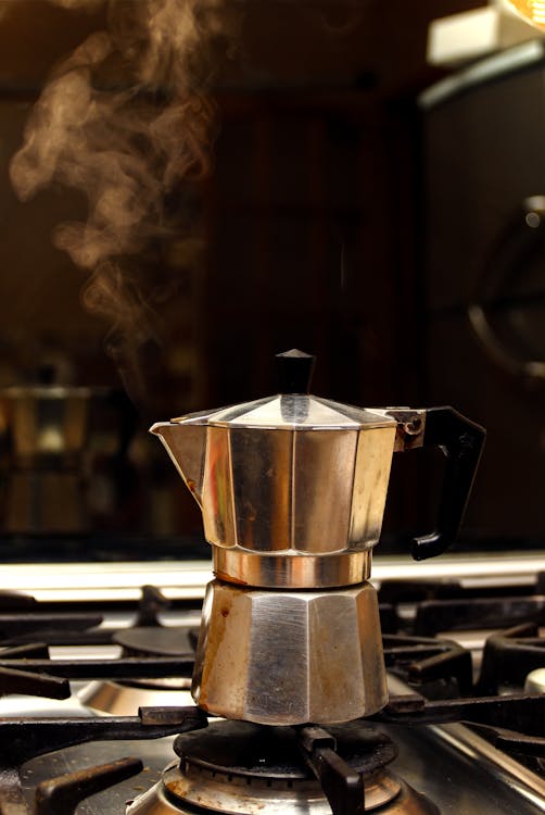 Moka Coffee Maker Pot On Gas Stove. Stock Photo, Picture and