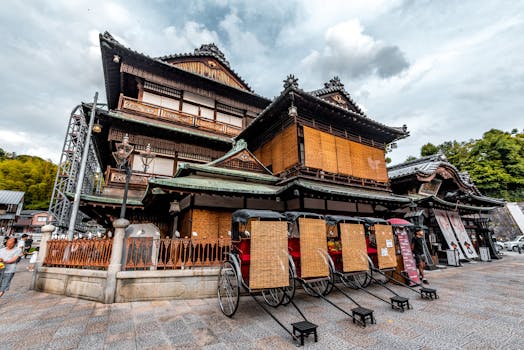 Charming Japanese building with rickshaws in front, showcasing traditional architecture.