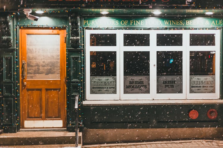 Door And A Window Of A Store During Snow 