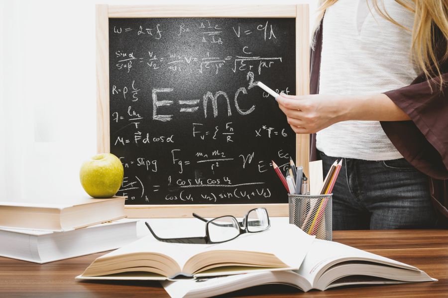 Open mathematics exercise book with handwritten notes