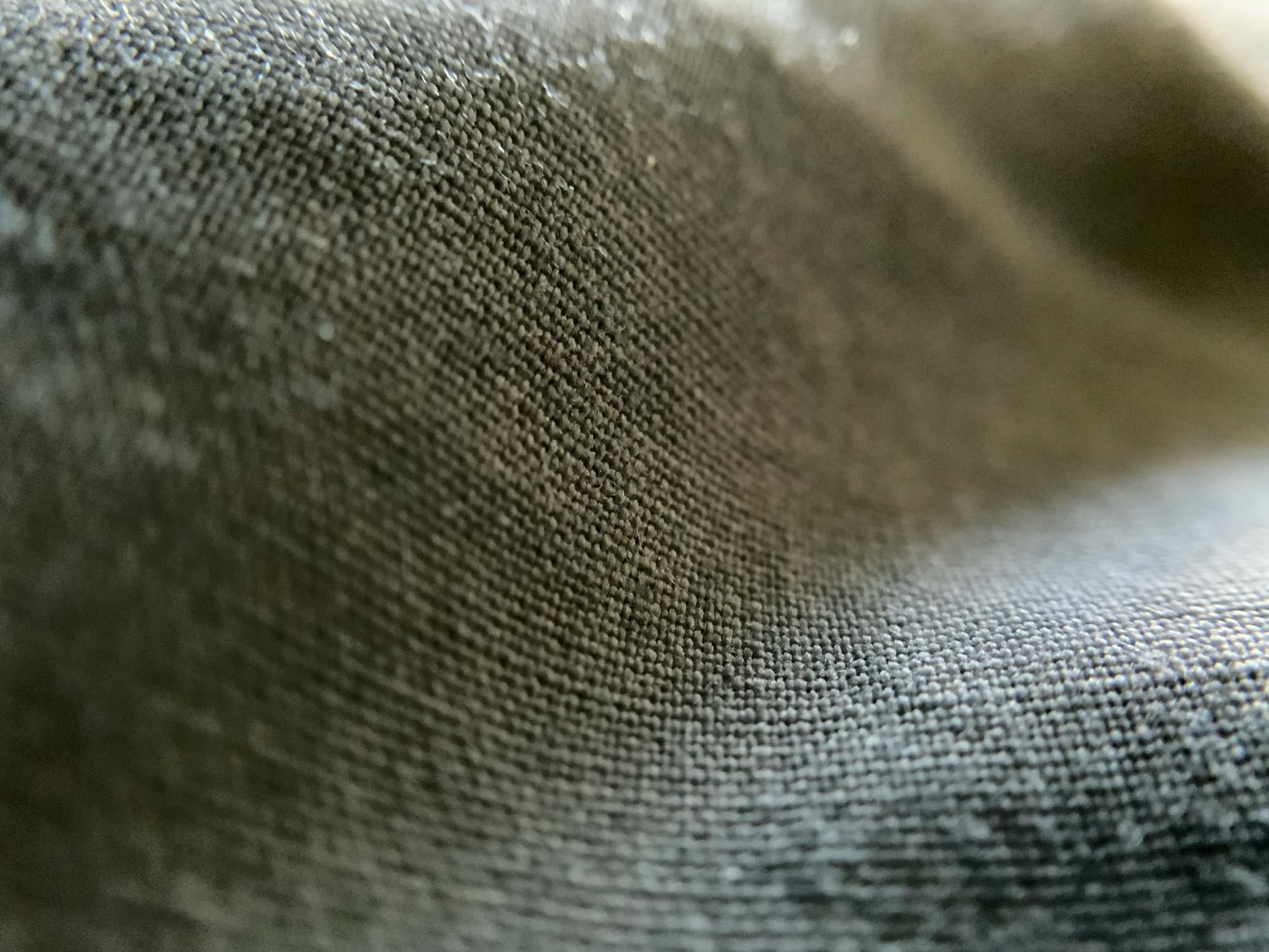 Hand holding a smartphone with cryptocurrency charts, symbolizing crypto investing and growth.