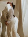 Man and Woman Holding White Textile