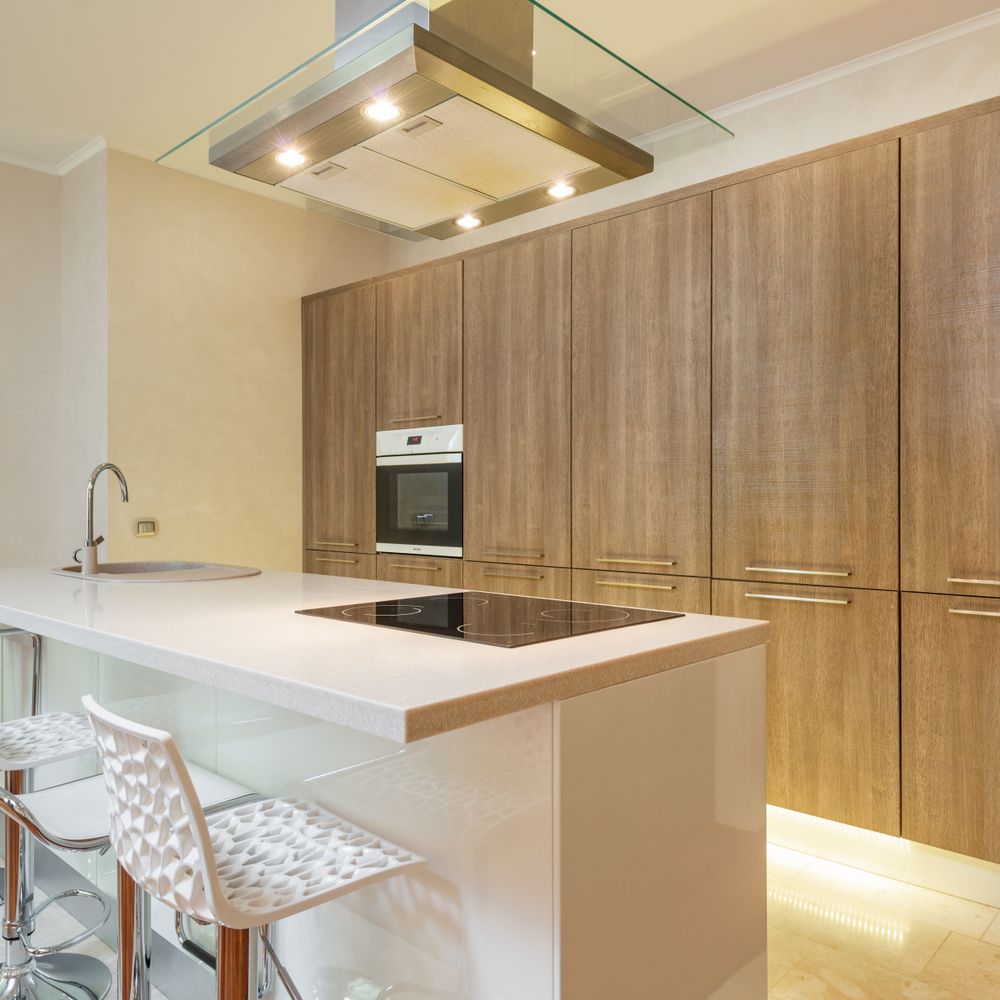 Kitchen Spraying in New Malden — clean edges cut in around trim and sockets