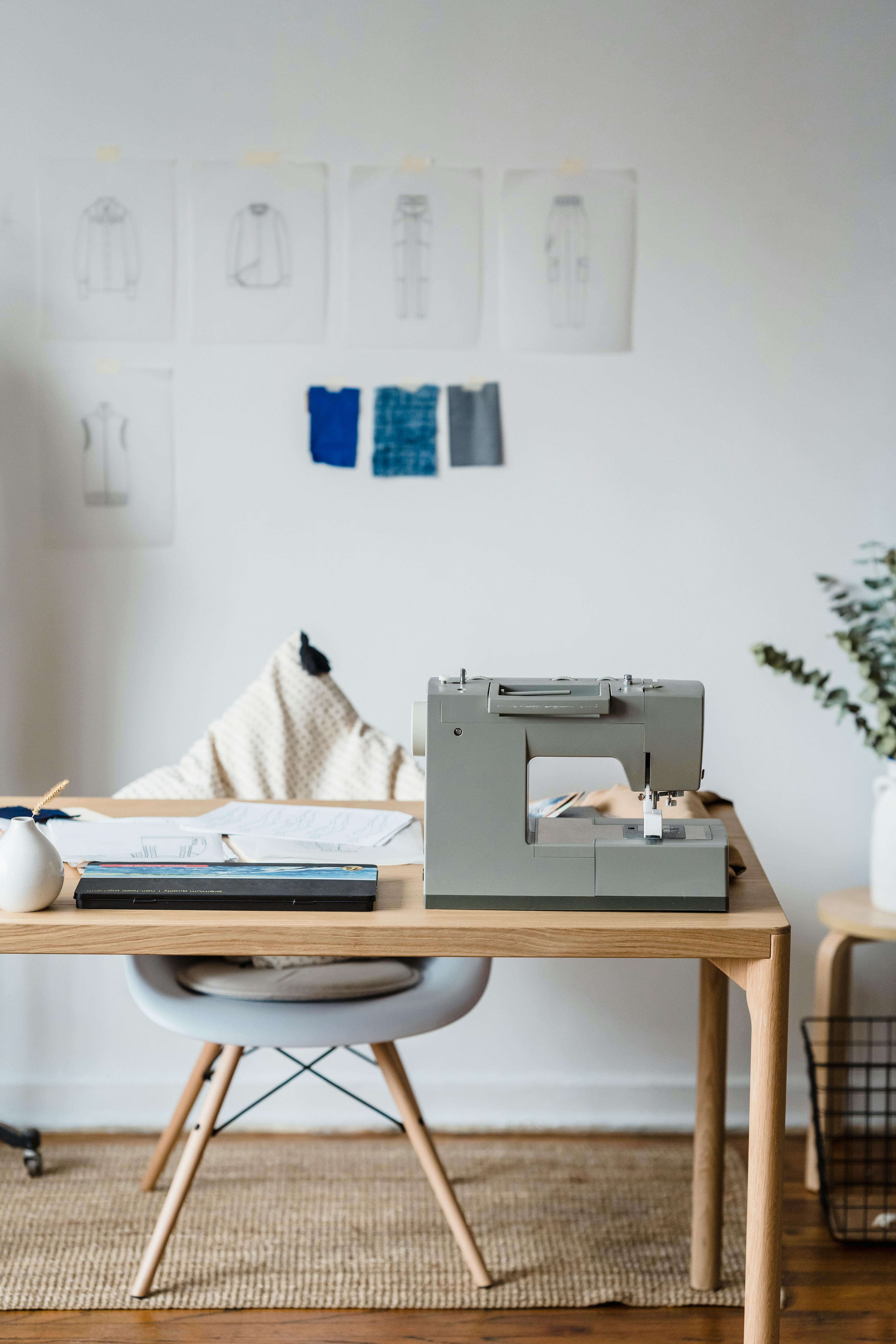 sewing machine near wall with sketches