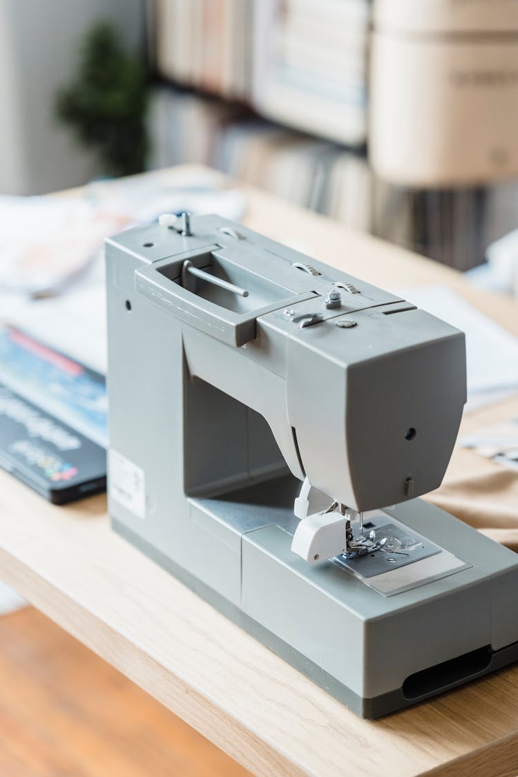 Sewing Machine On Wooden Table