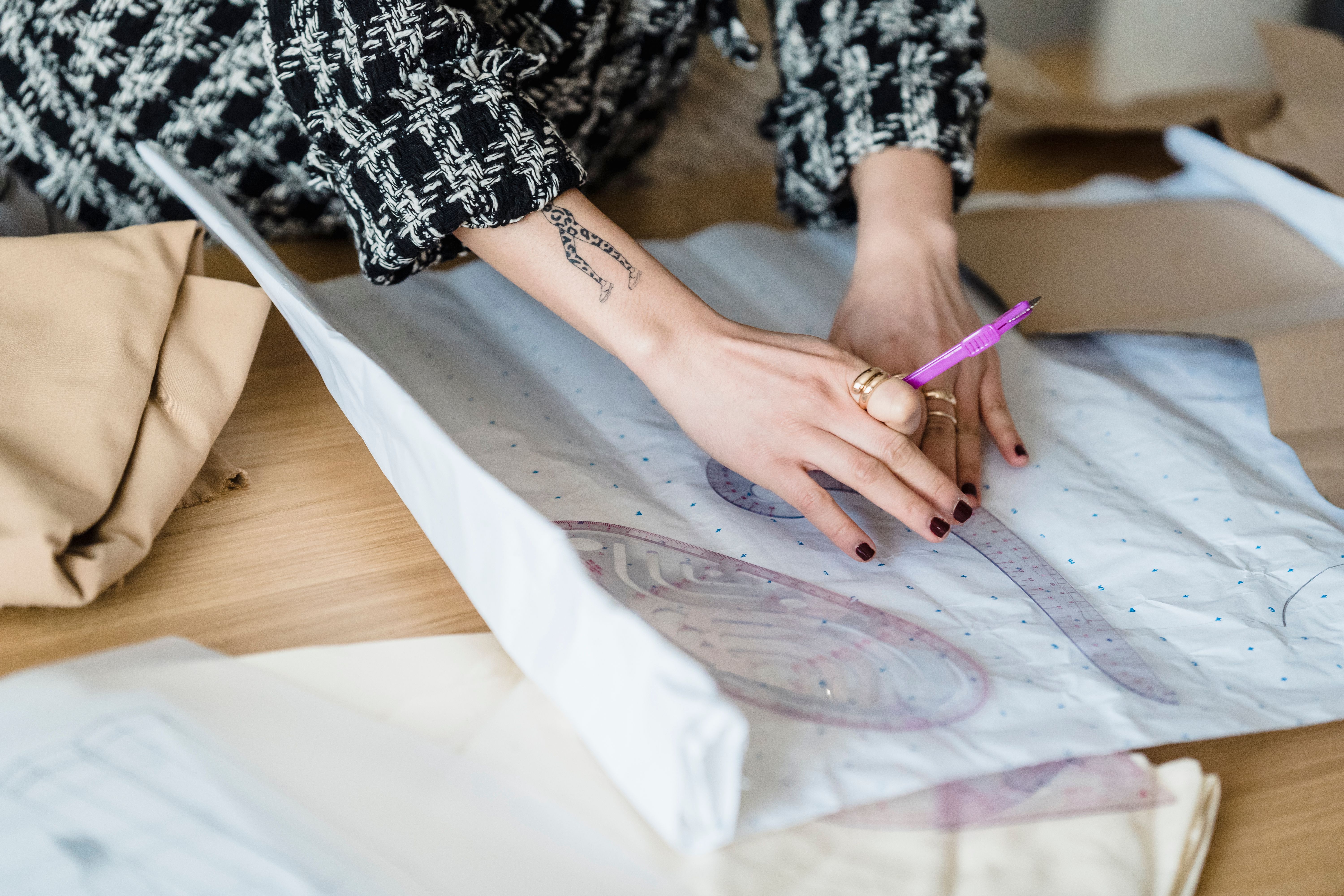Atelier workspace with organized fabric rolls and tools