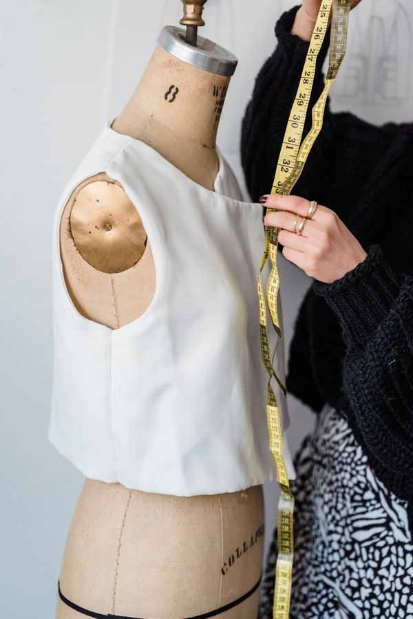 Measuring the jacket on a mannequin