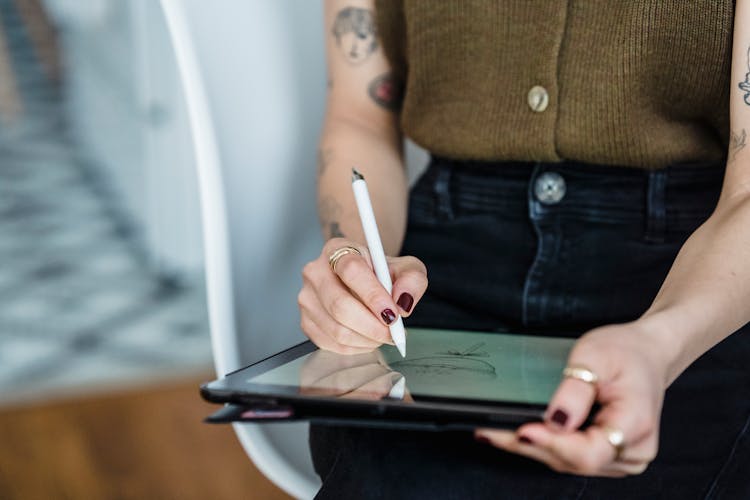 Unrecognizable Woman Making Sketches On Graphic Tablet