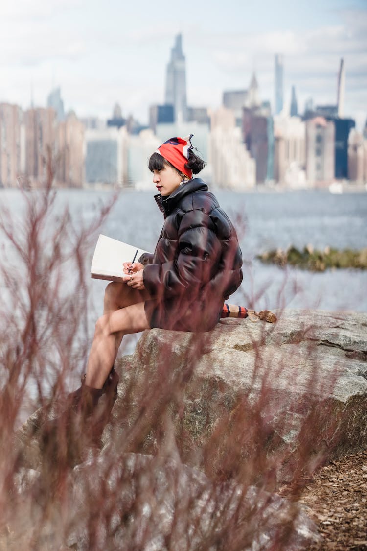 Talented Young Asian Painter Creating Sketch Near River In City