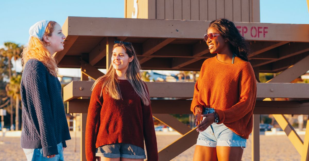 diverse group of young friends having honest conversation about money and finances
