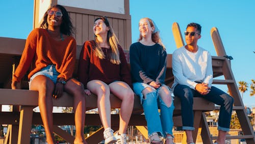 Group of Friends Sitting on Lifeguard Post