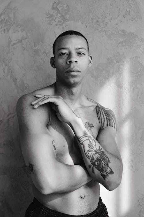 Grayscale Portrait of a Tattooed Man 