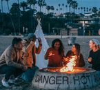 Group of Friends Sitting in Front of Fire Pit