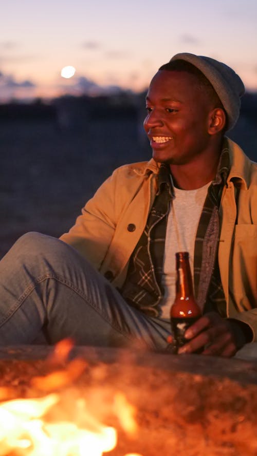 Man Holding a Beer Bottle