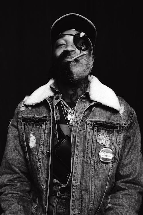 A Bearded Man in Denim Jacket Wearing an Eyepatch