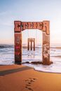 Brown Wooden Cross on Beach Shore