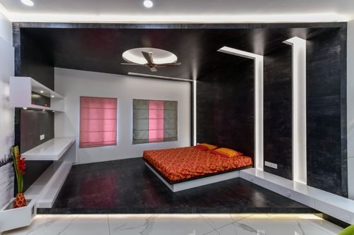 Free Luxurious and minimalist bedroom interior with bold design and stylish lighting. Stock Photo