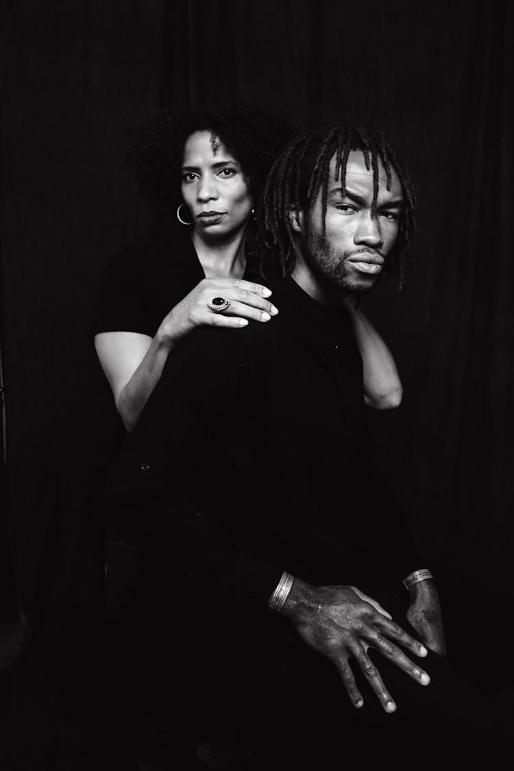 Photoshoot Of Man And Woman In Black Background 