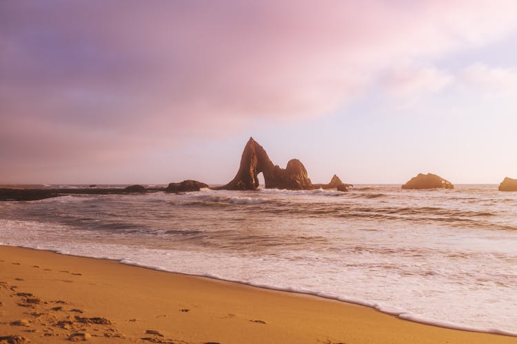 Brown Rock Formation On Beach