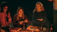 Three Women Eating Pizza