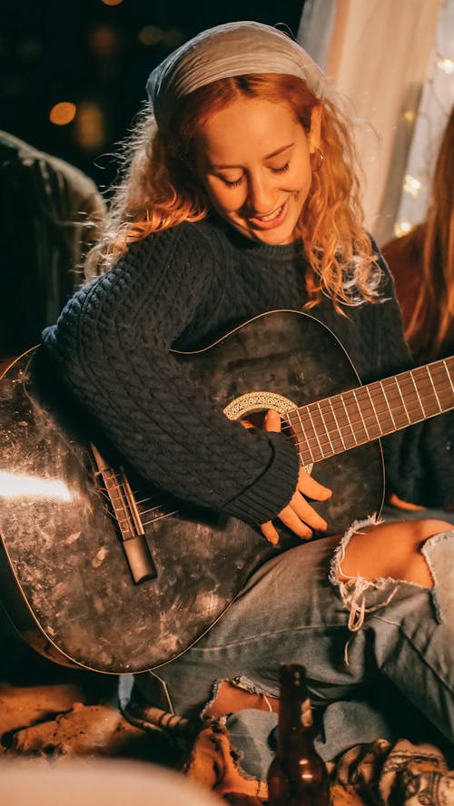 Woman Playing Guitar