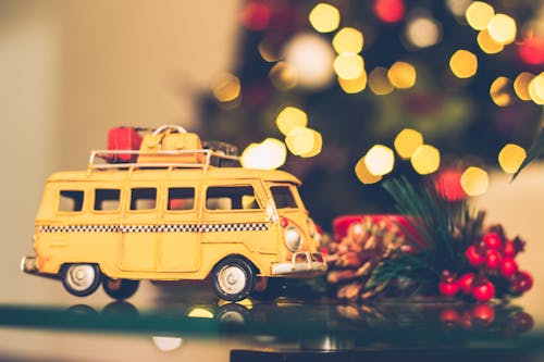 Free Selective Focus Photography of Yellow Vehicle Scale Model Stock Photo