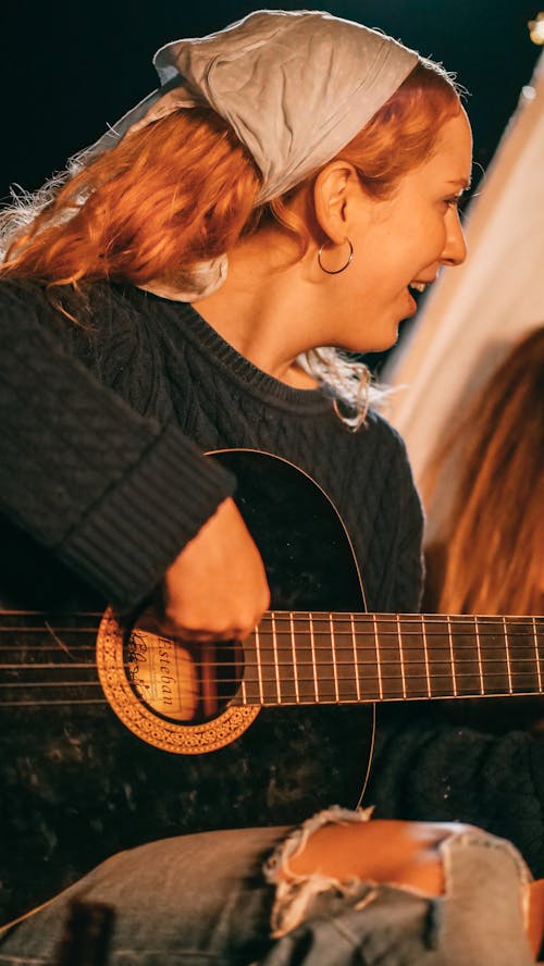 Free Woman Playing Guitar Stock Photo