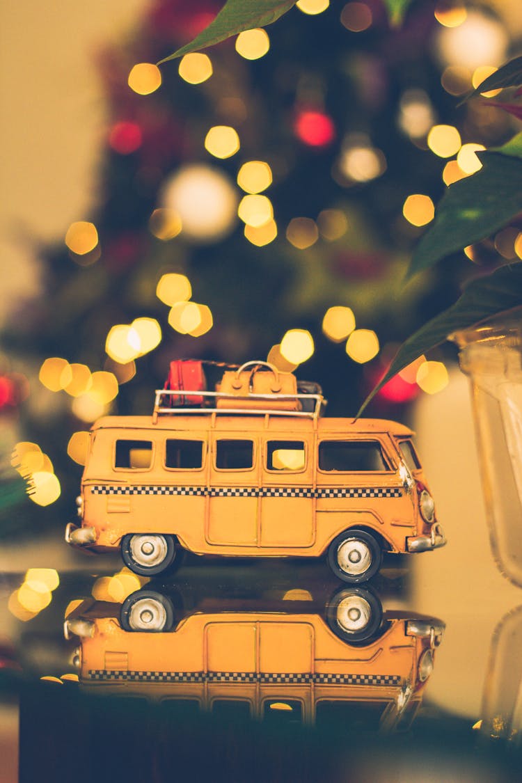 Macro Shot Photography Of Brown Volkswagen Van Figure On Table